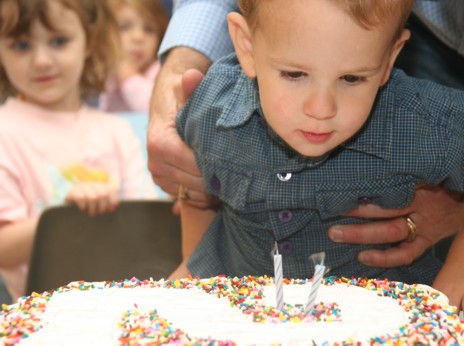 Owen blowing out his candles